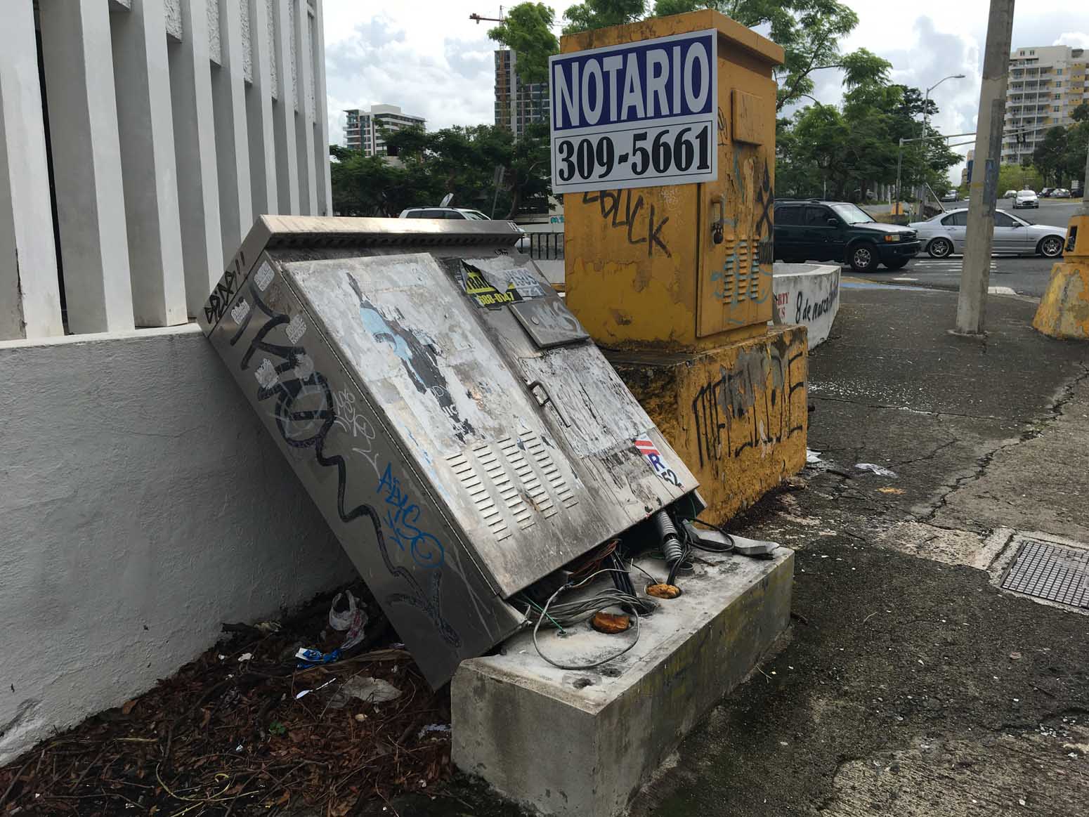A damaged sidewalk junction box